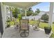 Covered patio with outdoor seating, perfect for enjoying the landscaped backyard at 205 Marsh Deer Place, Surfside Beach, SC 29575