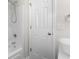 Bathroom features a sink, shower, tub and white door at 2072 Haystack Way, Myrtle Beach, SC 29579