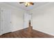 Bedroom featuring wood floor, ceiling fan and white doors at 2072 Haystack Way, Myrtle Beach, SC 29579