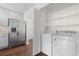 Laundry room with white appliances and shelves at 2072 Haystack Way, Myrtle Beach, SC 29579