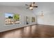 Bright living room featuring high ceilings, hardwood floors, front door, and large windows at 2072 Haystack Way, Myrtle Beach, SC 29579