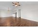 Open floor plan of the living room with dark wood floors and vaulted ceiling, open to kitchen at 2072 Haystack Way, Myrtle Beach, SC 29579