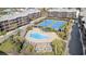 Aerial view of condo community with pool, tennis courts, and surrounding landscaping, offering amenities at 210 N Ocean Blvd. # 333, North Myrtle Beach, SC 29582