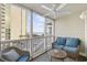 Enjoy the ocean view from this screened in balcony with comfortable seating, ideal for relaxation at 210 N Ocean Blvd. # 333, North Myrtle Beach, SC 29582