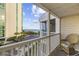 Balcony with beach views overlooking a parking lot and a neighboring condo building at 210 N Ocean Blvd. # 333, North Myrtle Beach, SC 29582