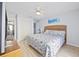 Bedroom featuring a woven headboard, ceiling fan, closet, and adjoining bathroom at 210 N Ocean Blvd. # 333, North Myrtle Beach, SC 29582