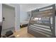 Bright bedroom featuring a bunk bed and a twin bed, ideal for Gathering vacations at 210 N Ocean Blvd. # 333, North Myrtle Beach, SC 29582