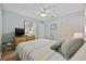 Bedroom features a queen size bed, mirror, chair, closet, ceiling fan, and wood-look flooring at 210 N Ocean Blvd. # 333, North Myrtle Beach, SC 29582