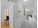 Hallway with views to the kitchen and living room, featuring tile floors at 210 N Ocean Blvd. # 333, North Myrtle Beach, SC 29582