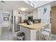 Cozy kitchen featuring a breakfast bar with stools and ample counter space at 210 N Ocean Blvd. # 333, North Myrtle Beach, SC 29582