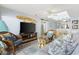 Inviting living room featuring stylish wicker furniture, a large television, and decor with a coastal theme at 210 N Ocean Blvd. # 333, North Myrtle Beach, SC 29582