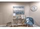 Shot of unit's entryway area decorated with gold table, decorative artwork, chair, and seagrass basket at 2100 Sea Mountain Hwy. # 202, North Myrtle Beach, SC 29582