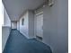 View of the HarbourGate Resort and Marina hallway with carpet flooring and doors to individual units at 2100 Sea Mountain Hwy. # 202, North Myrtle Beach, SC 29582