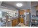 Kitchen with stainless steel appliances, dual sinks, and adjacent dining area at 2100 Sea Mountain Hwy. # 202, North Myrtle Beach, SC 29582