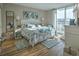 Bright main bedroom with balcony access and coastal decor at 2100 Sea Mountain Hwy. # 202, North Myrtle Beach, SC 29582