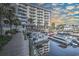 View of the HarbourGate Resort and Marina from the marina showing boats docked on a partially cloudy day at 2100 Sea Mountain Hwy. # 202, North Myrtle Beach, SC 29582
