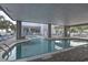 View of the indoor pool at HarbourGate Resort and Marina with lounge chairs on the deck at 2100 Sea Mountain Hwy. # 202, North Myrtle Beach, SC 29582