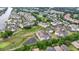 Aerial view of a condo community with a pond, pool, parking, and golf course at 2241 Waterview Dr. # 532, North Myrtle Beach, SC 29582