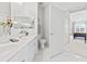 Bathroom featuring double sinks, white tile flooring, and a door leading into the bedroom at 2241 Waterview Dr. # 532, North Myrtle Beach, SC 29582