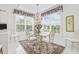 Bright dining room featuring a chandelier, large windows with floral valances, and an area rug at 2241 Waterview Dr. # 532, North Myrtle Beach, SC 29582