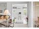The view through the doorway highlights the eat-in kitchen with white cabinets and bright natural light at 2241 Waterview Dr. # 532, North Myrtle Beach, SC 29582