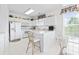 Bright, all-white kitchen with modern appliances, ample counter space, and a cozy breakfast nook at 2241 Waterview Dr. # 532, North Myrtle Beach, SC 29582