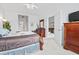 Spacious primary bedroom featuring neutral carpet, wood furniture, and entry to ensuite bath at 2241 Waterview Dr. # 532, North Myrtle Beach, SC 29582