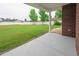 Covered patio overlooks a large, well-maintained backyard with a white fence at 249 Ashepoo Creek Dr., Myrtle Beach, SC 29579