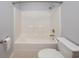 Clean bathroom featuring a shower-tub combo with tile flooring and a toilet with a white finish at 249 Ashepoo Creek Dr., Myrtle Beach, SC 29579