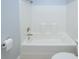 Simple bathroom features a clean white tub and toilet at 249 Ashepoo Creek Dr., Myrtle Beach, SC 29579