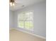Bright bedroom with neutral carpet, a ceiling fan, and a window with white blinds at 249 Ashepoo Creek Dr., Myrtle Beach, SC 29579
