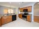 Well-equipped kitchen showcases wood cabinets, stainless steel appliances, and granite countertops at 249 Ashepoo Creek Dr., Myrtle Beach, SC 29579