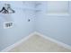 Well-lit laundry room with washer/dryer hookups and storage shelving at 249 Ashepoo Creek Dr., Myrtle Beach, SC 29579