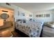 Well-lit bedroom with two beds, calming artwork, and an attached bathroom at 2801 S Ocean Blvd. # 1041, North Myrtle Beach, SC 29582