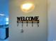 Welcoming entryway featuring a decorative 'Welcome' sign and a nearby kitchen view at 2801 S Ocean Blvd. # 1041, North Myrtle Beach, SC 29582