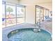 Indoor hot tub and ocean view through large windows, providing relaxation at 2801 S Ocean Blvd. # 1041, North Myrtle Beach, SC 29582