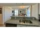 Kitchen sink and granite countertops opening into the living room area and Ocean View at 2801 S Ocean Blvd. # 1041, North Myrtle Beach, SC 29582