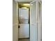 Efficient laundry closet with a stacked washer and dryer unit at 2801 S Ocean Blvd. # 1041, North Myrtle Beach, SC 29582