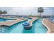Inviting lazy river with lounge chairs, perfect for relaxing under the palm trees at 2801 S Ocean Blvd. # 1041, North Myrtle Beach, SC 29582