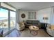 Cozy living room featuring balcony access and ocean view at 2801 S Ocean Blvd. # 1041, North Myrtle Beach, SC 29582