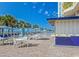 Poolside patio with seating area, umbrellas, and blue-covered tables near the ocean at 2801 S Ocean Blvd. # 1041, North Myrtle Beach, SC 29582