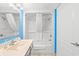 Clean bathroom featuring a shower-tub combo with curtain, toiletries, and a well-lit vanity at 2801 S Ocean Blvd. # 1634, North Myrtle Beach, SC 29582