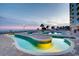 An elevated lazy river with beach views alongside a resort building at sunset at 2801 S Ocean Blvd. # 1634, North Myrtle Beach, SC 29582