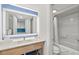 Well-lit bathroom with a spacious vanity, large mirror, and a shower-tub combination at 3000 N Ocean Blvd. N # 129, Myrtle Beach, SC 29577