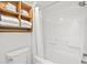 Clean bathroom featuring a shower/tub with a white curtain, stacked towels, and essential fixtures at 3000 N Ocean Blvd. N # 129, Myrtle Beach, SC 29577