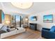 Cozy living room featuring a comfortable sofa, ocean-themed decor, and a balcony with beach views at 3000 N Ocean Blvd. N # 129, Myrtle Beach, SC 29577