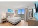 Comfortable bedroom with a large window offering scenic views at 3000 N Ocean Blvd. N # 1401, Myrtle Beach, SC 29577