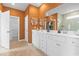 Bathroom vanity with double sinks, framed mirrors, white cabinets, and neutral wall color at 3021 Sistine St., Myrtle Beach, SC 29579