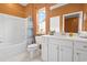 Bright bathroom with white vanity, tub/shower combo, and stylish decor at 3021 Sistine St., Myrtle Beach, SC 29579