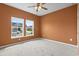 Neutral bedroom featuring plush carpeting, natural light, and a ceiling fan at 3021 Sistine St., Myrtle Beach, SC 29579